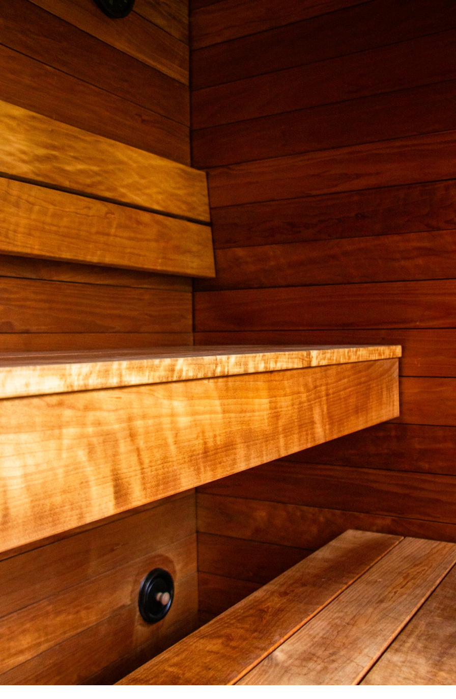 Handcrafted Finnish wood bench detail inside the iHKA sauna